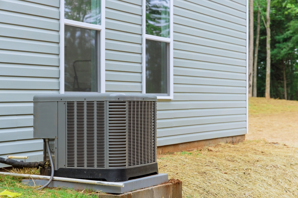 HVAC technician providing AC services that actually deliver by servicing a residential air conditioning system